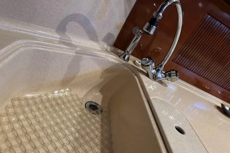 Solid Rock Yacht Photos Pics Kitchen sink and faucet on a 2003 Sea Ray 380 Sundancer yacht.