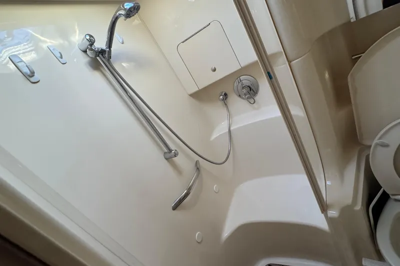 Solid Rock Yacht Photos Pics Bathroom interior of 2003 Sea Ray 380 Sundancer yacht with shower and toilet.