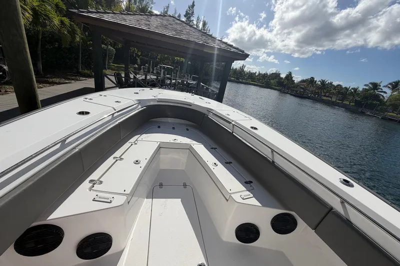  Yacht Photos Pics 2023 Cape Horn 32 XS boat docked by a scenic waterfront under a sunny sky.