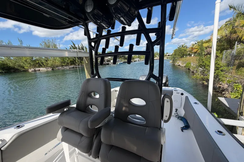  Yacht Photos Pics 2023 Cape Horn 32 XS boat interior with dual seats and rod holders on a sunny day.