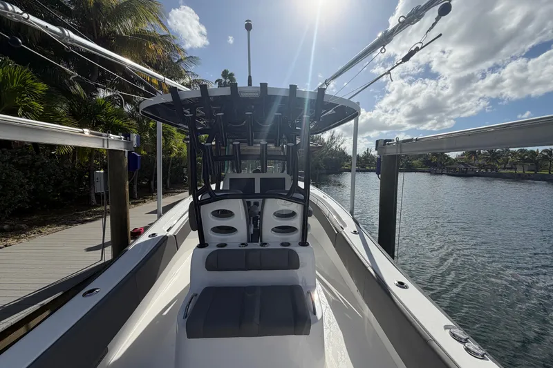  Yacht Photos Pics 2023 Cape Horn 32 XS boat docked by a scenic waterfront under a sunny sky.
