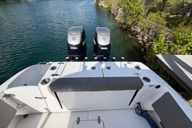 Yacht Photos Pics 2023 Cape Horn 32 XS boat with dual Suzuki 350 engines on a serene waterway.