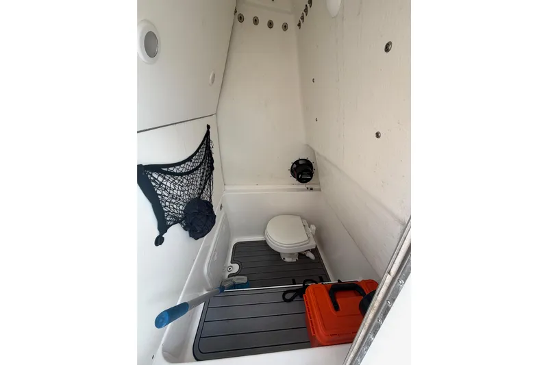  Yacht Photos Pics 2023 Cape Horn 32 XS boat interior with toilet and storage area.