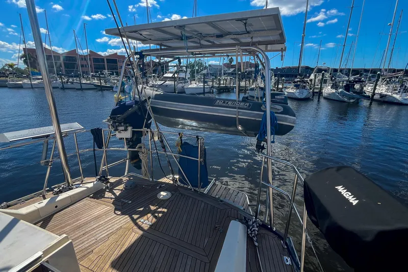 Pacific Pearl Yacht Photos Pics Sailboat deck view with dinghy, marina background, Oyster LW48, 1991 model.