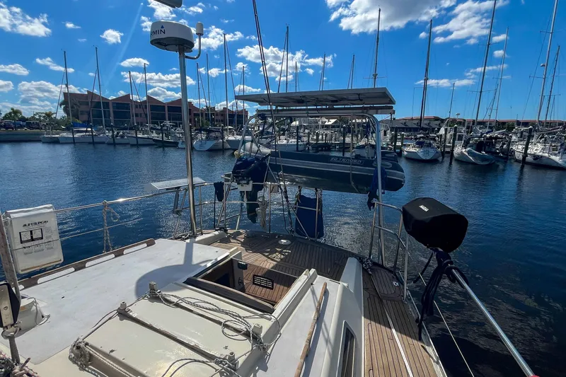 Pacific Pearl Yacht Photos Pics Sailboat docked in marina, Oyster LW48, 1991 model, sunny day with blue sky.