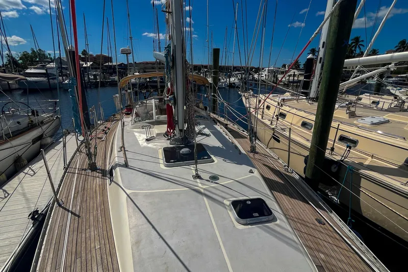 Pacific Pearl Yacht Photos Pics Sailboat docked at marina, Oyster LW48, 1991 model, sunny day, clear blue sky.
