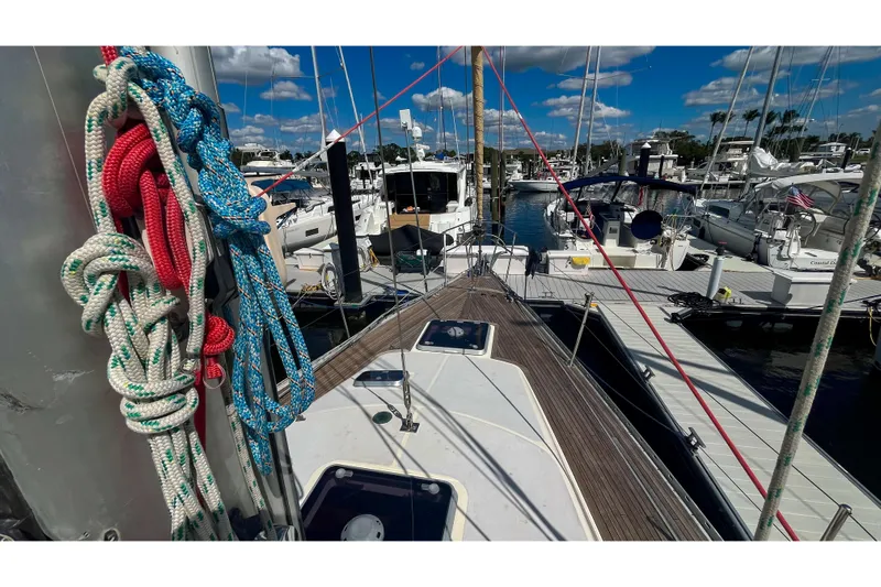 Pacific Pearl Yacht Photos Pics Sailboat deck view with colorful ropes, docked at marina; Oyster LW48, 1991 model.