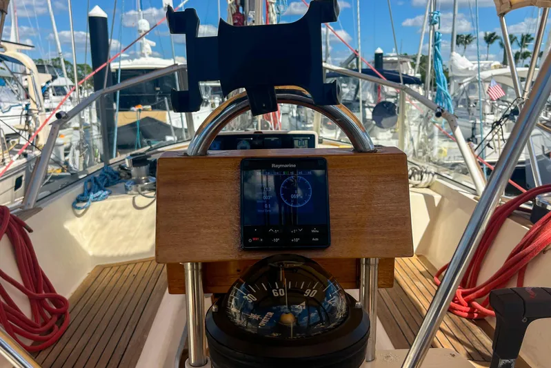 Pacific Pearl Yacht Photos Pics Cockpit view of 1991 Oyster LW48 sailboat with navigation instruments and compass.