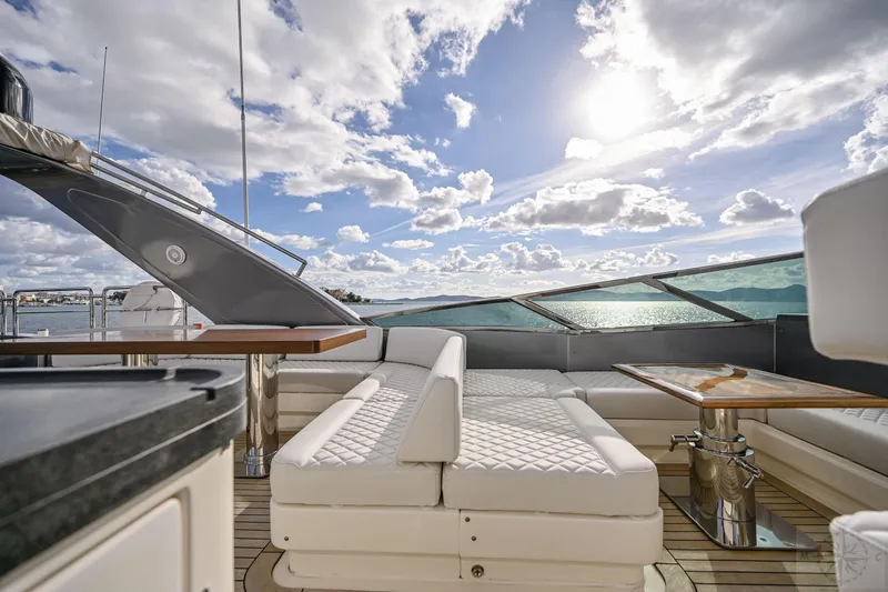  Yacht Photos Pics Luxurious 2007 Azimut 98 Leonardo yacht deck with elegant seating under a bright sky.