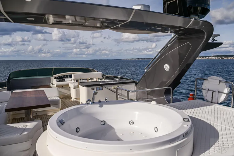  Yacht Photos Pics Luxurious 2007 Azimut 98 Leonardo yacht deck with jacuzzi and ocean view.