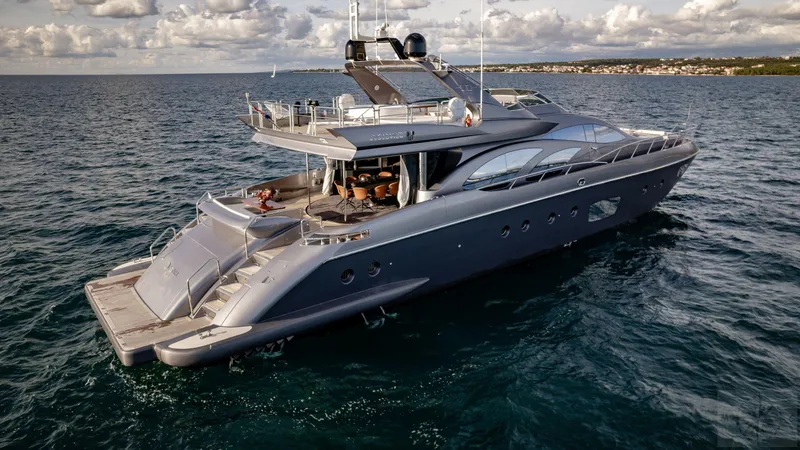  Yacht Photos Pics Luxury 2007 Azimut 98 Leonardo yacht cruising on open sea under cloudy sky.