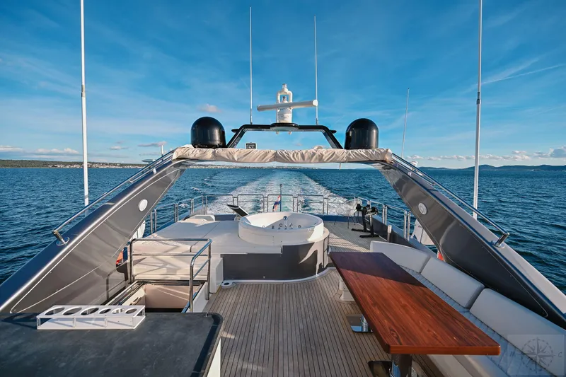  Yacht Photos Pics Luxurious 2007 Azimut 98 Leonardo yacht deck with seating and ocean view.