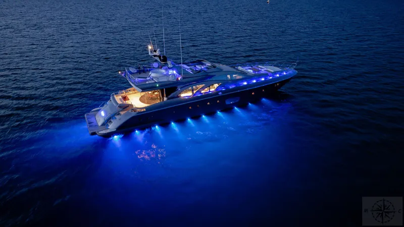  Yacht Photos Pics Luxurious 2007 Azimut 98 Leonardo yacht illuminated at night on the water.