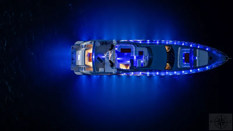  Yacht Photos Pics Aerial view of 2007 Azimut 98 Leonardo yacht illuminated with blue lights at night.