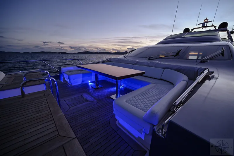  Yacht Photos Pics Luxurious 2007 Azimut 98 Leonardo yacht deck with elegant seating and ambient lighting at sunset.