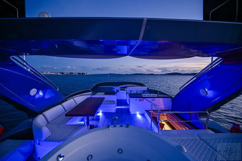  Yacht Photos Pics Luxurious 2007 Azimut 98 Leonardo yacht with elegant deck lighting at sunset.
