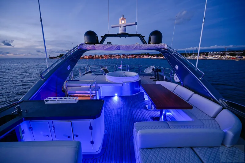  Yacht Photos Pics Luxurious 2007 Azimut 98 Leonardo yacht deck with ambient blue lighting at dusk.