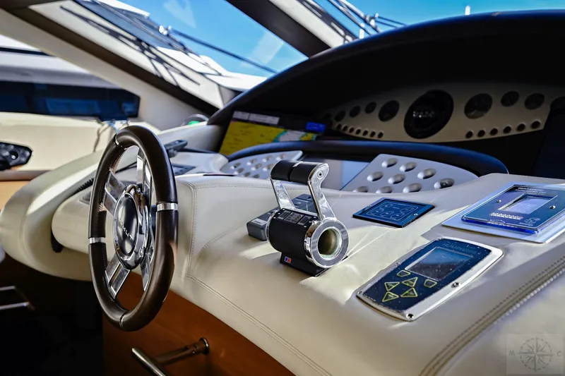  Yacht Photos Pics Cockpit of 2007 Azimut 98 Leonardo yacht with modern navigation controls and steering wheel.