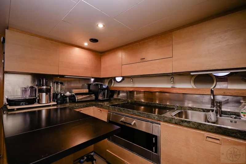  Yacht Photos Pics Luxurious kitchen interior of 2007 Azimut 98 Leonardo yacht with modern appliances.