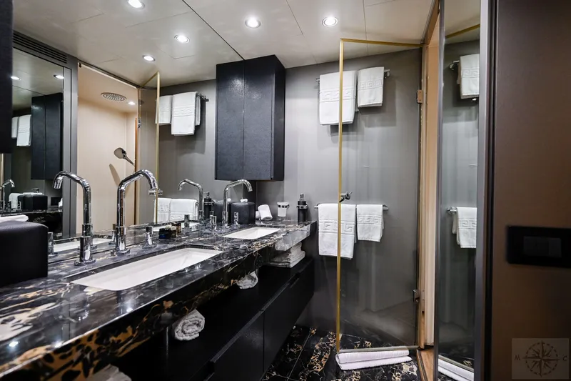  Yacht Photos Pics Luxurious bathroom in 2007 Azimut 98 Leonardo yacht with marble countertops and modern fixtures.