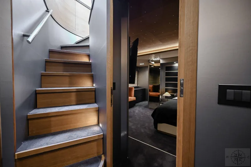  Yacht Photos Pics Luxurious interior of 2007 Azimut 98 Leonardo yacht, featuring elegant staircase and modern bedroom.