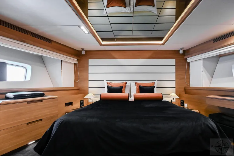  Yacht Photos Pics Luxurious bedroom interior of 2007 Azimut 98 Leonardo yacht with modern design elements.