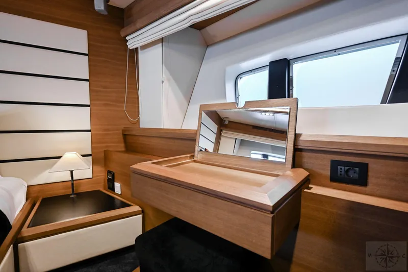  Yacht Photos Pics Luxurious cabin interior of 2007 Azimut 98 Leonardo yacht with vanity and window view.