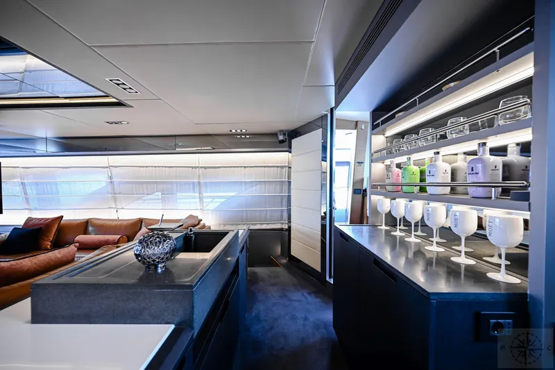  Yacht Photos Pics Luxurious interior of 2007 Azimut 98 Leonardo yacht with modern furnishings and elegant bar setup.