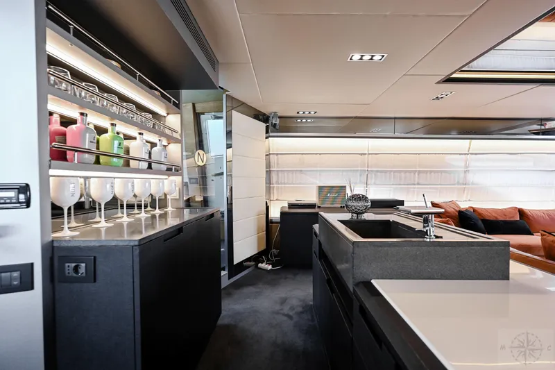  Yacht Photos Pics Luxurious interior of 2007 Azimut 98 Leonardo yacht with modern kitchen and bar area.