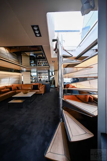  Yacht Photos Pics Luxurious interior of 2007 Azimut 98 Leonardo yacht with modern staircase and elegant seating.