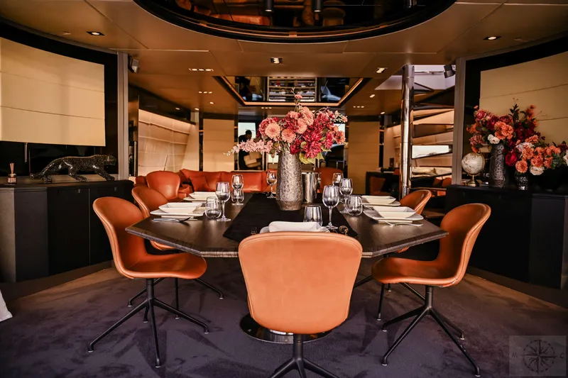  Yacht Photos Pics Luxurious dining area on a 2007 Azimut 98 Leonardo yacht with elegant decor and floral arrangements.