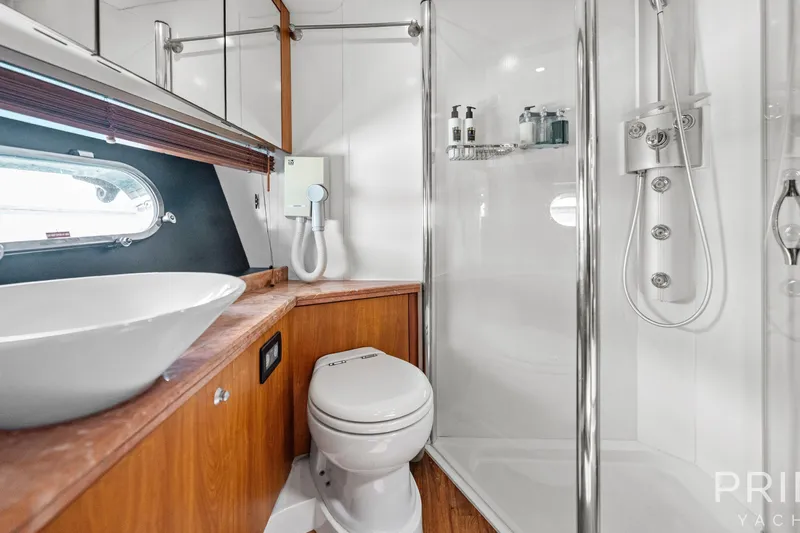  Yacht Photos Pics Luxurious bathroom in 2008 Sunseeker Manhattan 70 yacht with modern fixtures and elegant design.