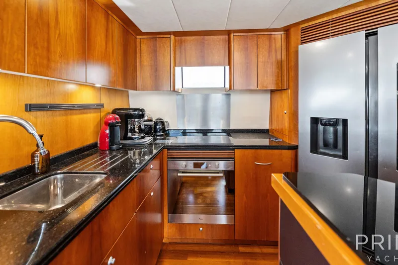  Yacht Photos Pics Luxurious kitchen interior of 2008 Sunseeker Manhattan 70 yacht with modern appliances.