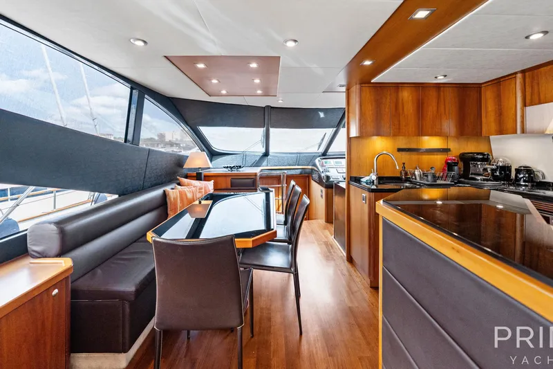  Yacht Photos Pics Luxurious interior of 2008 Sunseeker Manhattan 70 yacht with modern kitchen and dining area.