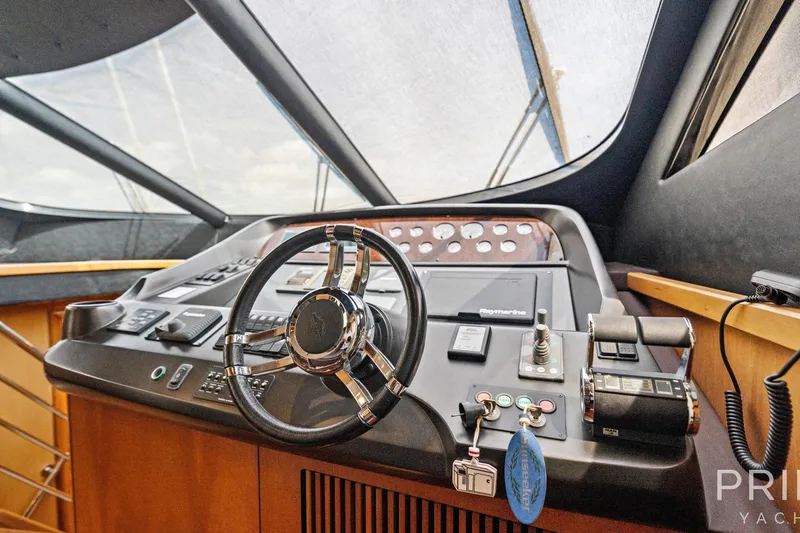  Yacht Photos Pics Steering console of 2008 Sunseeker Manhattan 70 yacht with modern controls and navigation equipment.