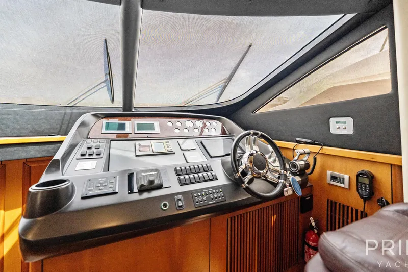  Yacht Photos Pics Cockpit of 2008 Sunseeker Manhattan 70 yacht with modern navigation controls and steering wheel.