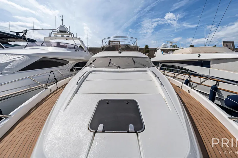  Yacht Photos Pics 2008 Sunseeker Manhattan 70 yacht docked, showcasing sleek design and spacious deck.