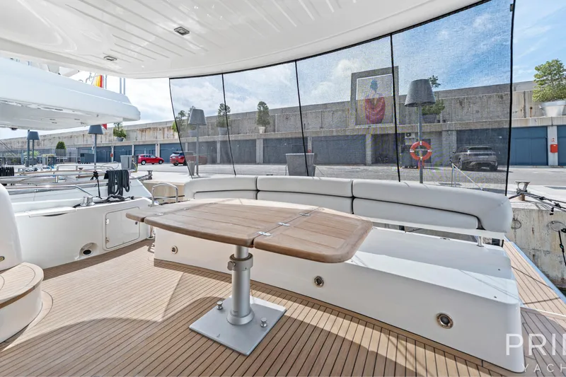  Yacht Photos Pics Luxurious 2008 Sunseeker Manhattan 70 yacht deck with seating and wooden table.