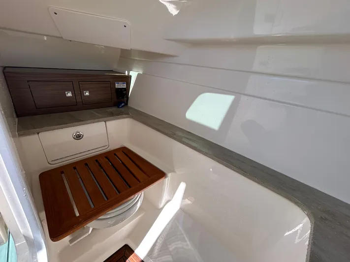  Yacht Photos Pics Interior of 2021 Boston Whaler 320 Vantage boat, featuring a compact cabin space.