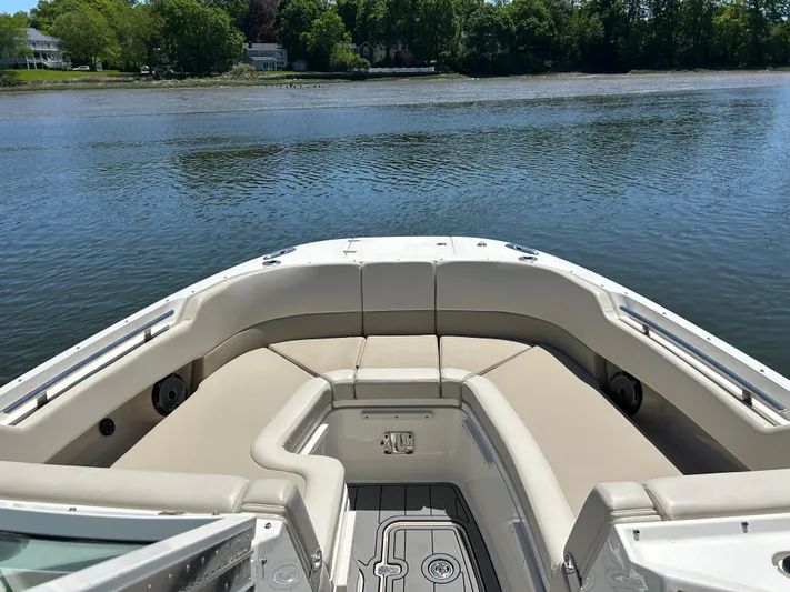  Yacht Photos Pics 2021 Boston Whaler 320 Vantage boat with spacious seating on a calm lake.