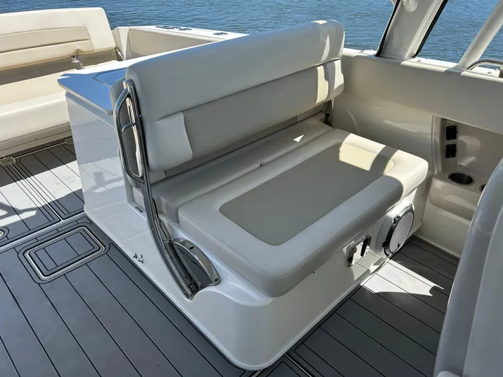  Yacht Photos Pics 2021 Boston Whaler 320 Vantage boat interior with cushioned seating and sleek design.