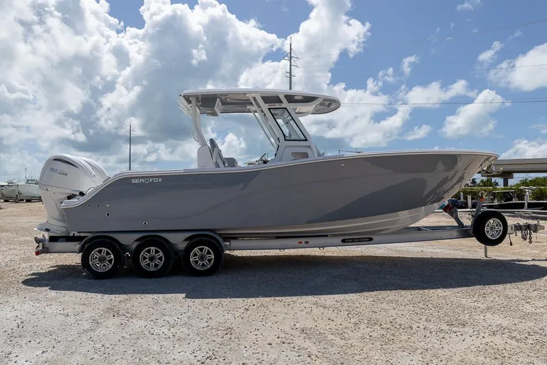  Yacht Photos Pics 2026 Sea Fox 288 Commander boat on trailer under cloudy sky.