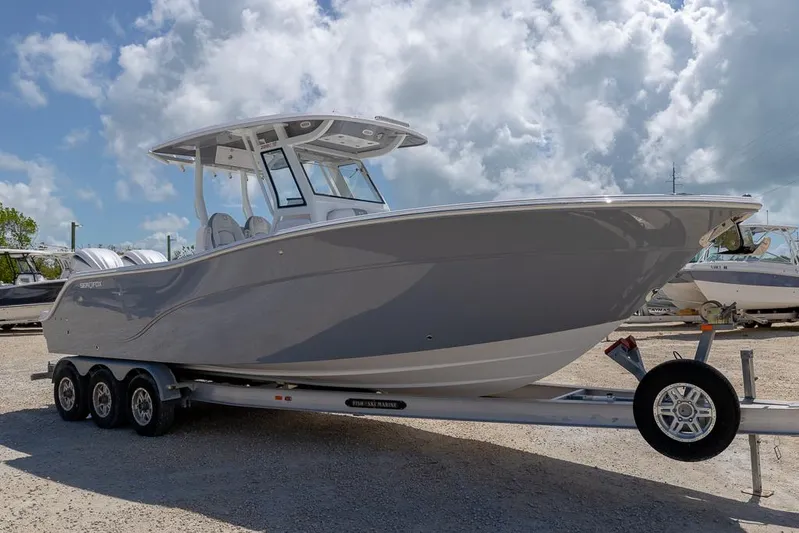  Yacht Photos Pics 2026 Sea Fox 288 Commander boat on trailer under cloudy sky.