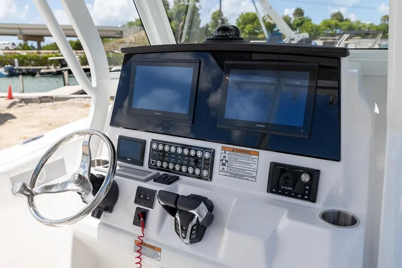  Yacht Photos Pics 2026 Sea Fox 288 Commander dashboard with dual screens and steering wheel.