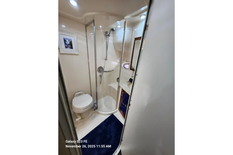 Magnolia Belle Yacht Photos Pics Bathroom interior of 2004 Sea Ray 390 Motor Yacht with shower and toilet.