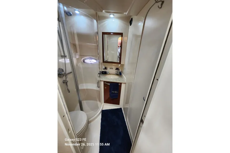 Magnolia Belle Yacht Photos Pics 2004 Sea Ray 390 Motor Yacht bathroom with shower, vanity, and mirror.