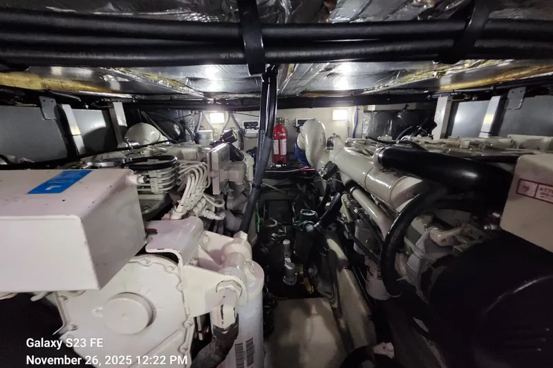 Magnolia Belle Yacht Photos Pics Engine room of a 2004 Sea Ray 390 Motor Yacht, showcasing mechanical components.