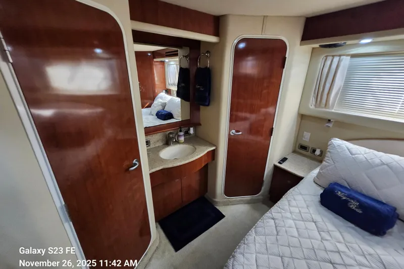 Magnolia Belle Yacht Photos Pics Luxurious 2004 Sea Ray 390 Motor Yacht interior with cozy bedroom and elegant wood finishes.