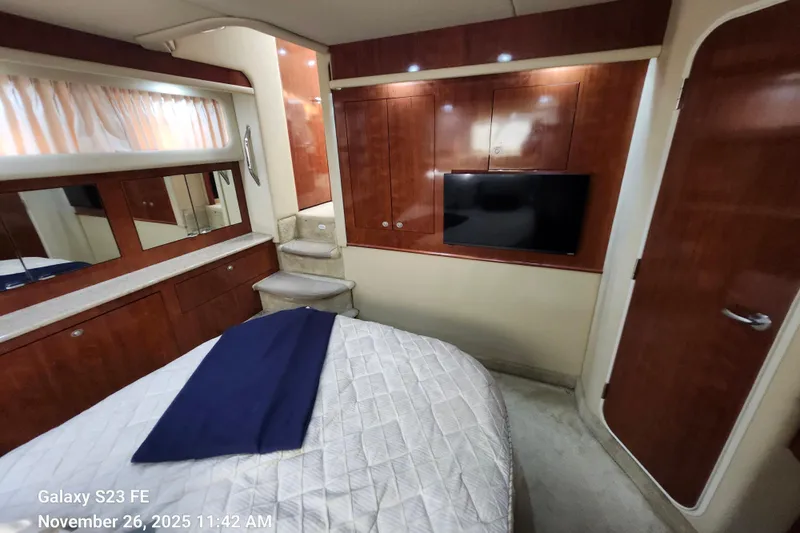 Magnolia Belle Yacht Photos Pics Luxurious interior of 2004 Sea Ray 390 Motor Yacht with wood cabinetry and modern amenities.