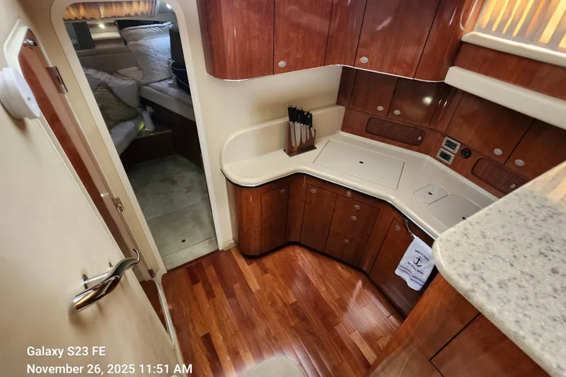 Magnolia Belle Yacht Photos Pics 2004 Sea Ray 390 Motor Yacht galley area and entry door to guest cabin.
